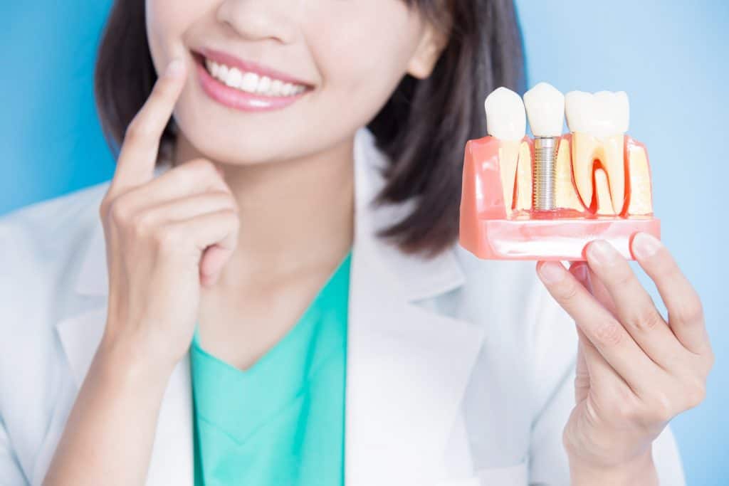 How Long Do I Have To Wait After Tooth Extraction To Get Dental Implants 